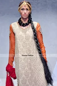 The shirt is pure banarsi chiffon having 3 types of embroidered borders on the hemline. Full sleeves have been adorned with large motifs on the upper part. The back of the shirt is orange color pure banarsi jamawar fabric.