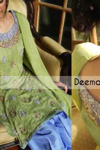 Pistachio green pure crinkle chiffon shirt and dupatta with blue pure raw silk trousers. The shirt has been embroidered with silver and gold embroidery on the neckline and stripes all over the front.