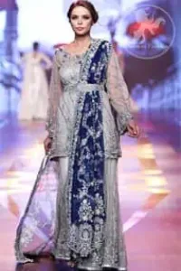 Silver Grey Bridal Dress - Short Shirt -Embroidered Sharara - Royal Blue Dupatta. Silver Grey Bridal Dress. The Grey short shirt has been adorned with an embellished neckline and border on the hemline.