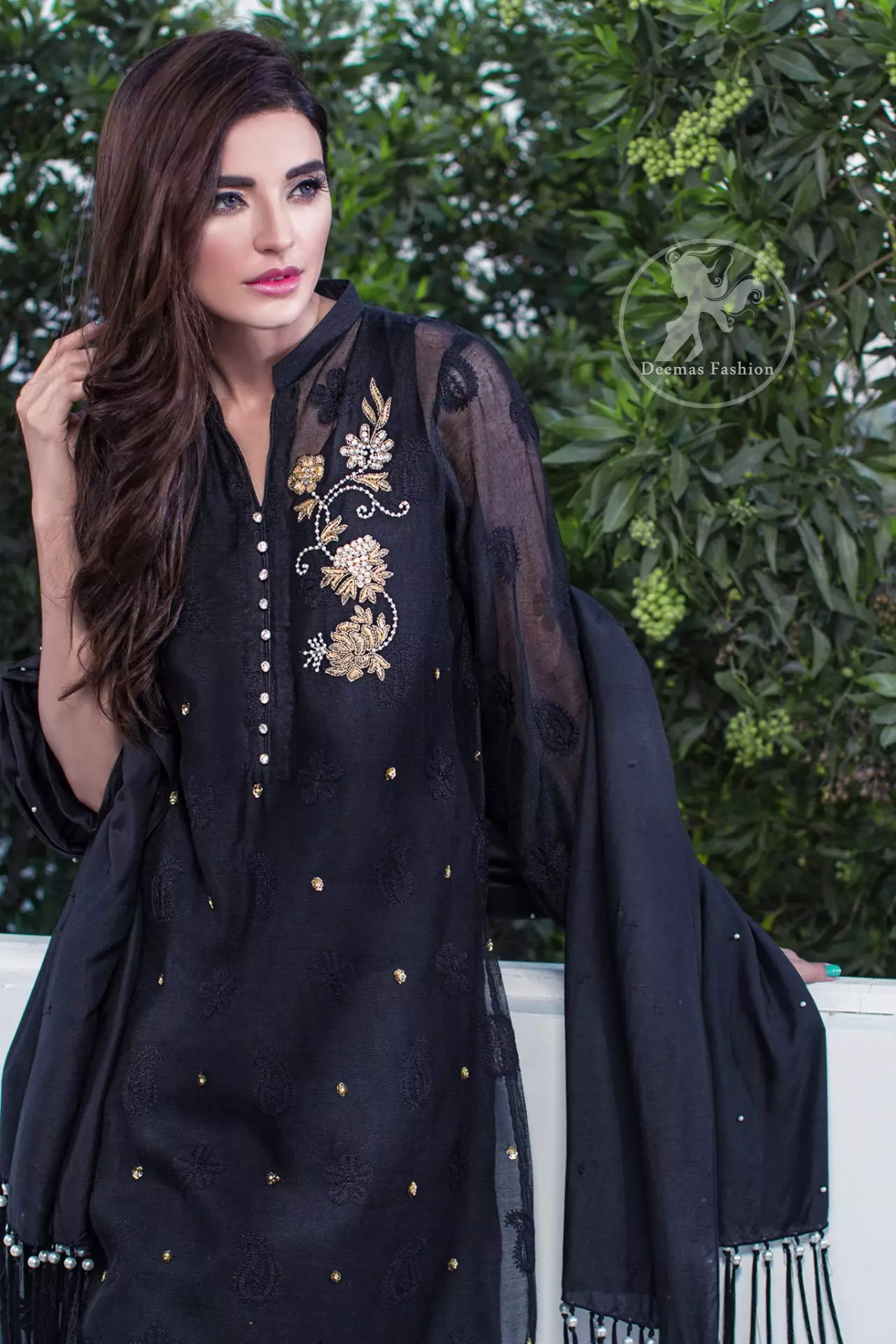 The black embroidered chiffon straight shirt has embroidered motifs which have been implemented on the shirt. This dress comes with a matching dupatta and trousers.