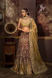 The blouse features marvellous and awesome embellishments accent all over the front and back. Concealed hooks closure front. Dusty gold applique work border implemented at the bottom of the lehenga. Dupatta has a four-sided embroidered border all around and contains medium and large-sized ornamental motifs crafted all over. Pearls and sequins spray all over with Scalloped edges finished.