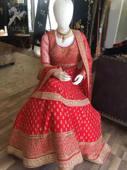 Simple but elegant deep red bridal blouse having dull golden and light antique embellishment. Appliqued with bright red fabric. Red