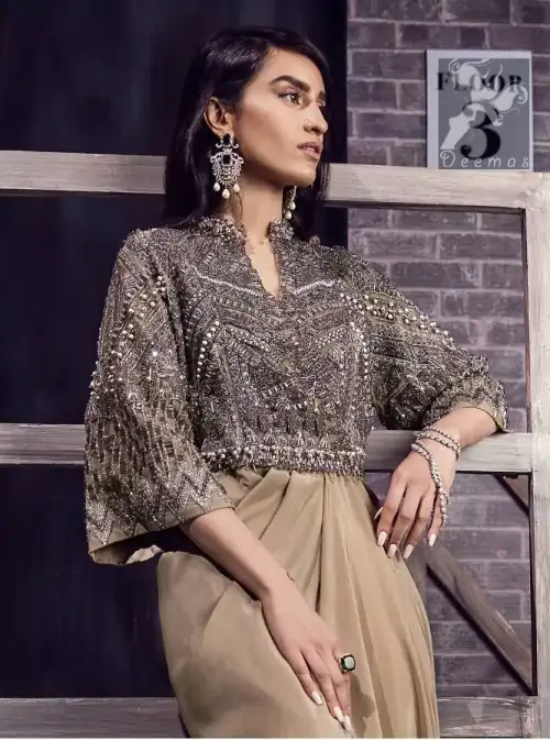 Fawn brown silky maxi has embellished bodice and sleeves. Bodice and sleeves have been embellished with dark gray embellishment and