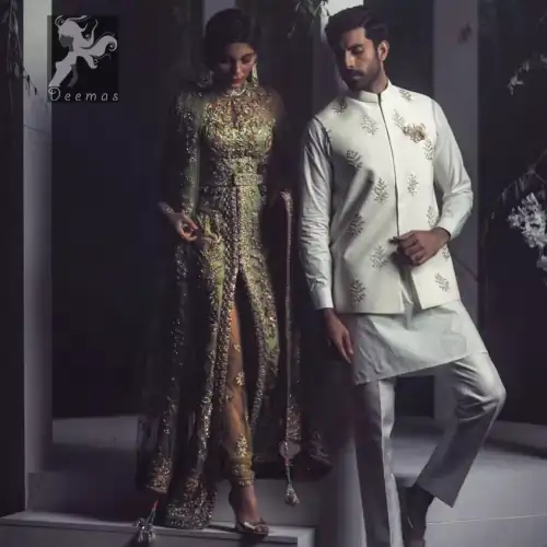 Pistachio green gown having high neck gown. Embellished Bodice with waist belt and front open slits. Mehndi green trousers having