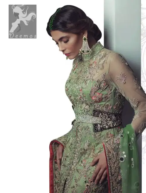Pistachio green gown having high neck gown. Embellished Bodice with waist belt and front open slits. Mehndi green trousers having