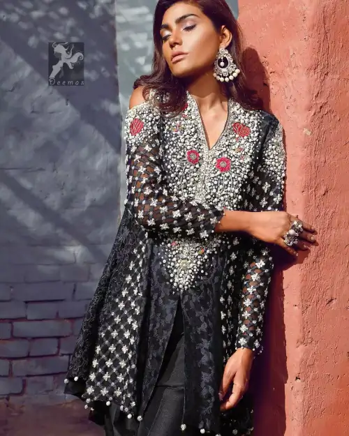 Black peplum made with pure banarsi jamawar chiffon. Peplum having multiple panels of different banarsi patterns. White and silver embellishment