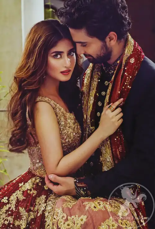 Frock having intricately embellished brown bodice and deep red frock embellished with tea pink, golden and brown shaded kora, dabka,