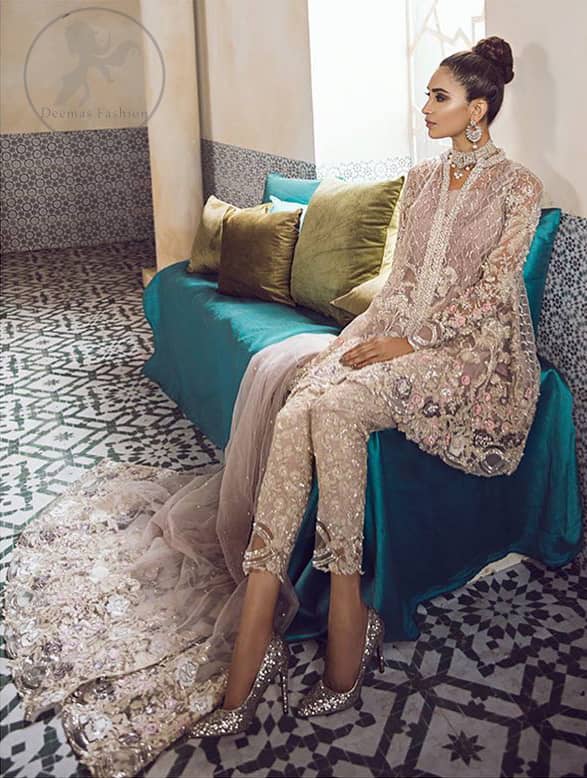 This beautiful peplum is adorned with floral embroidery. It is meticulously highlighted with silver kora, dabka, tilla, sequins, and pearls. It is further enhanced with scalloped border which adds to the look. Sleeves are fully embellished. It is artistically coordinated with embroidered pajama. It comes with chiffon dupatta which is sprinkled with sequins all over it.