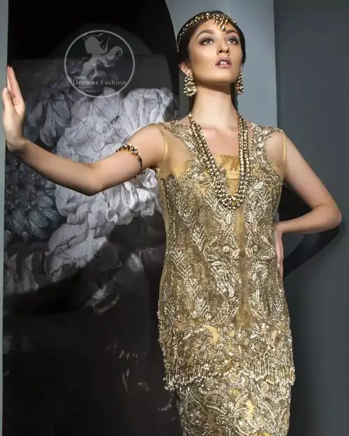 This dress is beautifully sculptured with floral embroidery. It is meticulously highlighted with antique shaded kora, dabka, tilla, sequins and