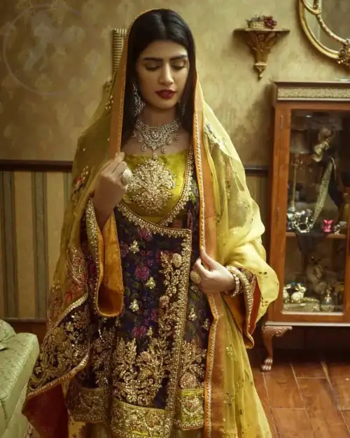 This  royal blue angrakha shirt is embellished with resham thread. It is meticulously highlighted with dull golden kora dabka, tilla, 