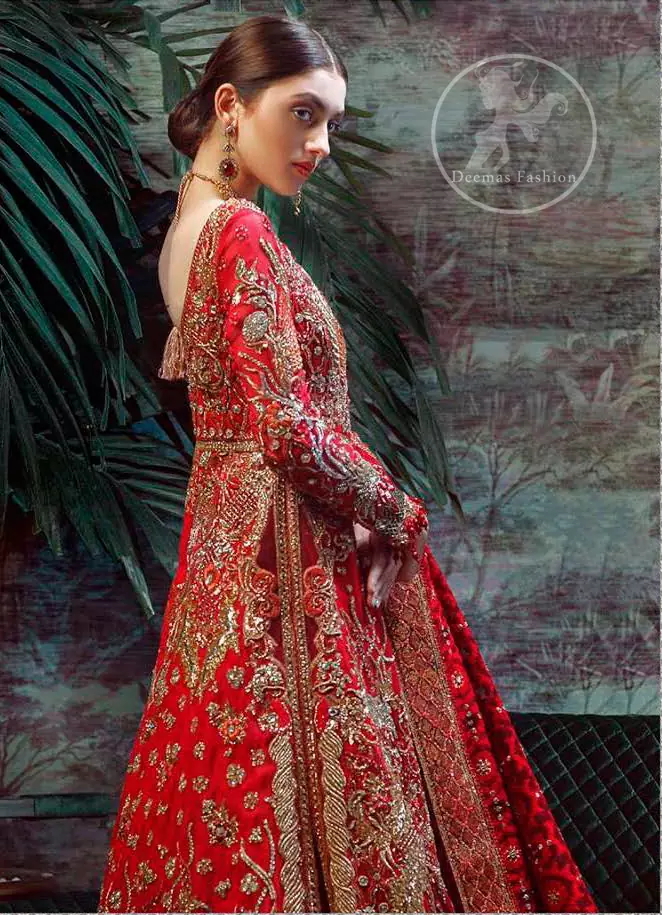 This dress is beautifully sculptured with floral thread embroidery. The halter shaped neckline meticulously highlighted with antique shaded kora, dabka, tilla, sequins and pearls. The shirt is ornamented with multiple color thread embroidered applique. It comes with chiffon dupatta which has four sided embellished border and sprinkled with sequins all over it. It is beautifully paired up with brocade sharara.