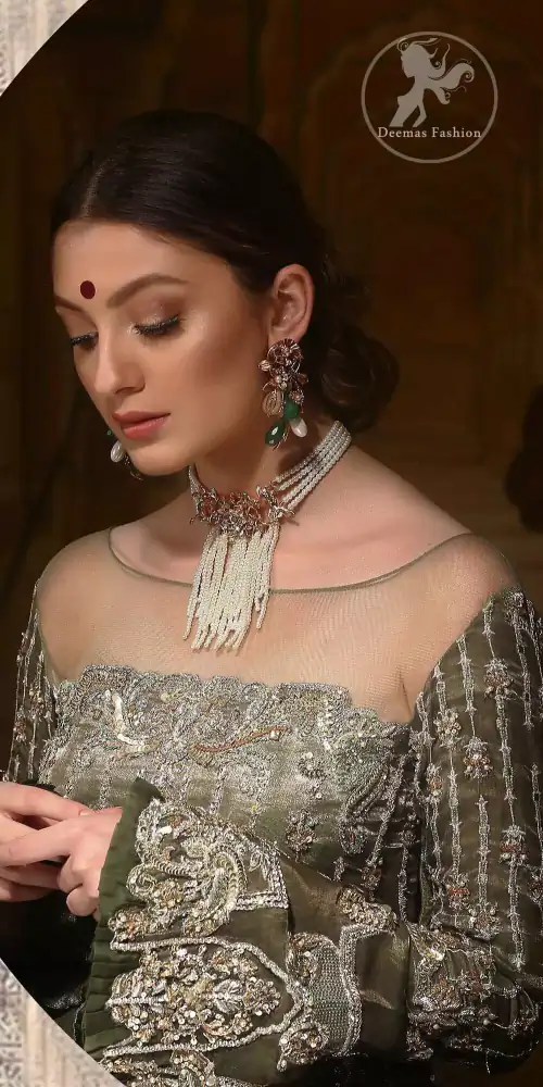 The beautiful bodice is decorated with intricate stones and sequins. It is further enhanced with vertical lines and floral motifs