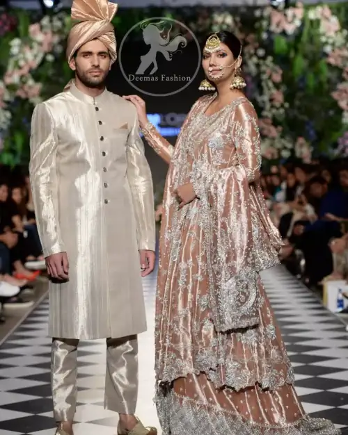 This dress is beautifully decorated with heavy embroidery. It is highlighted with kora, dabka, tilla, sequins and pearls. It comes