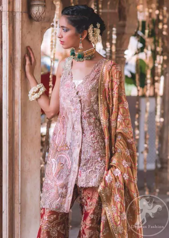 This outfit is executing heavily handcrafted art of zardozi. It is allured with kora, dabka, tilla, sequins and pearls. It comes with raw silk dupatta which is fully embellished. It comes with an exquisite high and low short shirt with thick embroidered borders to give it a regal look. This outfit is artfully coordinated with bell bottom embroidered trousers.