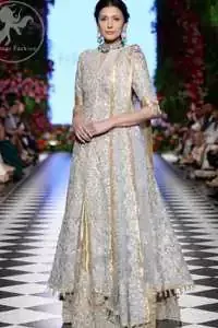 This dress is adorned with floral embroidery, highlighted with kora, dabka, tilla, sequins and pearls. It is allured with intricate embroidered motifs and delicate tassels. It is decorated with brocade applique. It comes with embellished lehengha. It is artistically coordinated with chiffon dupatta which is allured with four sided border.