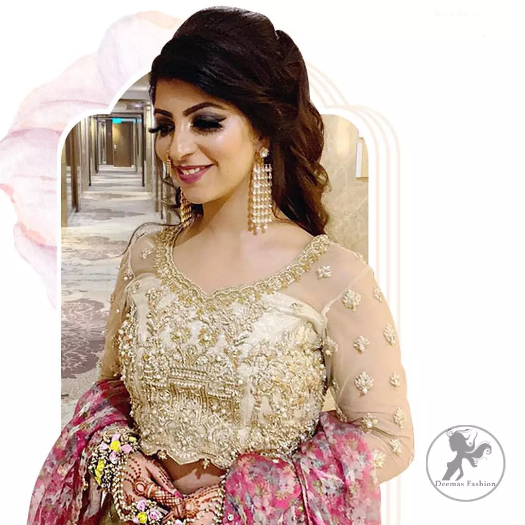 This dress is adorned with floral embroidery, highlighted with kora, dabka, tilla, sequins and pearls. It is allured with intricate embroidered motifs and detailed bodice. Blouse is scalloped. The border on hemline is enhanced with embellished floral pattern detailing, that instantly draws attention.It comes with embellished net lehengha with brocade lining. It is artistically coordinated with net dupatta which is allured with four sided border.