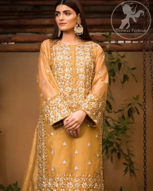 This dress is allured with floral embroidery. It is further enhanced with gota, kundan, sequins and pearls. It comes with