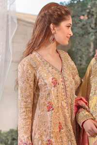 This super stunning back trail shirt is made of rich floral embroidery which is further enhanced with zerdosi work. It is finished with scalloped embellished border all around the shirt. Back of the shirt is decorated with small sized sprinkled motifs all over. The outfit is coordinated with shocking pink & pale green traditional gharara.