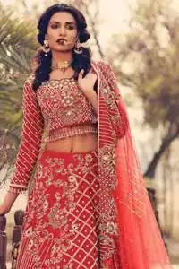 Boost your confidence and style in this glamorous blouse skirt with finest embroidery. The blouse is ornamented with light gold kora dabka, kundan and sequins work, elaborate it with tassels. The skirt is meticulously designed with vintage styled frames. It is further enhanced with light embroidered border along floral embroidery and zerdozi work. This outfit is coordinated with red dupatta with embroidered borders on all four sides and sprinkled sequins on the ground.