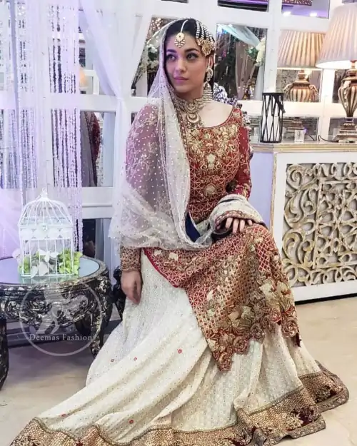 Make a dazzling impression in our zari embroidered copper rust shirt enhanced with intricately embellishmentswith gold and antique gold kora,