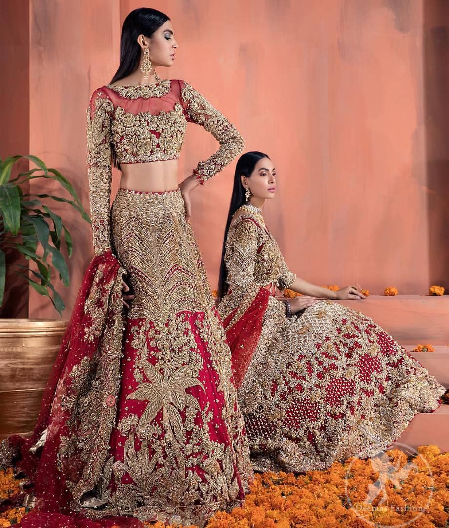 Reflecting royalty and the majestic beauty of statuesque shape and silhouette this bridal dress is perfect for your special day. This traditional outfit is aesthetically designed with motifs and floral patterns, embellished with kora, dabka, nakshi, sequins, crystals and stones. The back of the maxi also adorned with floral motifs in kora, dabka with sequin spray all over. It comes with brocade pajama. It is paired with heavily embroidered organza dupatta that gives the right amount of glamour to the outfit.