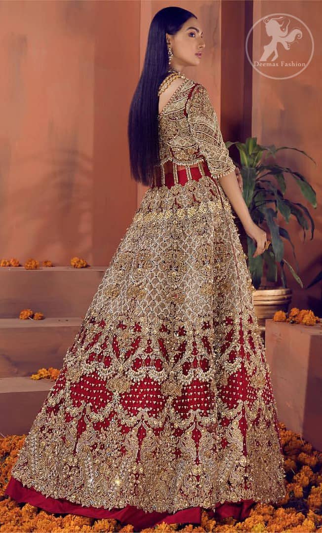 Reflecting royalty and the majestic beauty of statuesque shape and silhouette this bridal dress is perfect for your special day. This traditional outfit is aesthetically designed with motifs and floral patterns, embellished with kora, dabka, nakshi, sequins, crystals and stones. The back of the maxi also adorned with floral motifs in kora, dabka with sequin spray all over. It comes with brocade pajama. It is paired with heavily embroidered organza dupatta that gives the right amount of glamour to the outfit.