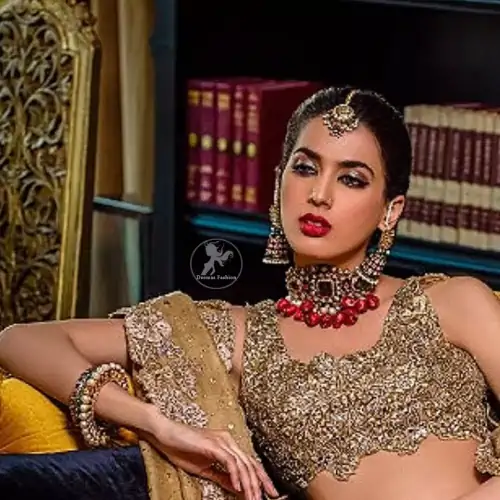 This bridal dress is perfect for your special day. Blouse is beautifully decorated with floral embroidery and embellished scalloped border.