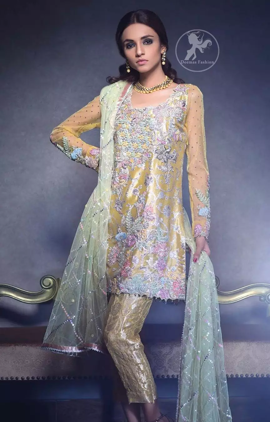 This super stunning  shirt is made of rich floral embroidery which is further enhanced with colorful gota work.  It is highlighted with gota work, sequins and pearls. The detailed scalloped border gives a perfect ending to this shirt. It comes with indian khaki trouser. It is coordinated with chiffon dupatta which is sprinkled with sequins all over it.