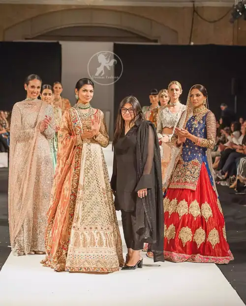 This dress is beautifully decorated with heavy embroidery. It is highlighted with dull golden kora, dabka, tilla, sequins and pearls.