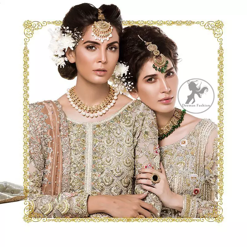 The perfect combination of tradition and class. Dazzle in this made to perfection, richly embroidered front open net outfit decorated with intricate zardozi embroidered front highlighted with kora, dabka, tilla, sequins and pearls embroidered borders on daaman and sleeves. Furthermore the shirt is fully decorated with sprinkled pearls all over it. This outfit is comprises with light olive green sharara highlighted with zardozi details at the bottom. Complete the look with tea rose dupatta sprinkled with sequins all over.