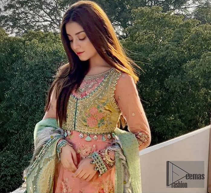 This pishwas is the perfect combination of tradition and class for mehndi mayon function or nikah day. Wear this soft and supple hues richly decorated by shades of golden and whites with thread embroidered motifs and floral bunches at daaman. The bottom of the pishwas is enhanced with lace finishing and tassels. Style it up with fully embellished velvet jacket. It comprises with churidar pajama. This nikah dress is coordinated with brocade dupatta having lace border on all four sides.