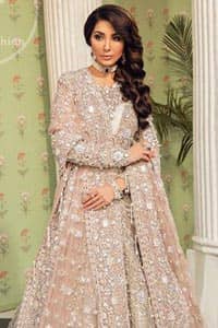 This outfit is a timeless beauty. Exude elegance and class in this full embroidered chiffon frock with zardosi work details and rich hemline. It is adorned with heavily embellished neckline and fixed waist belt. It comes with beautiful lehenga enhanced with thick embellished bottom to gives it a regal look.  This outfit is coordinated with net dupatta sprinkled with floral motifs all over it. The dupatta incorporates beautifully designed borders on all four sides, focusing on the heavily embellished pallu borders to give it a perfect look.
