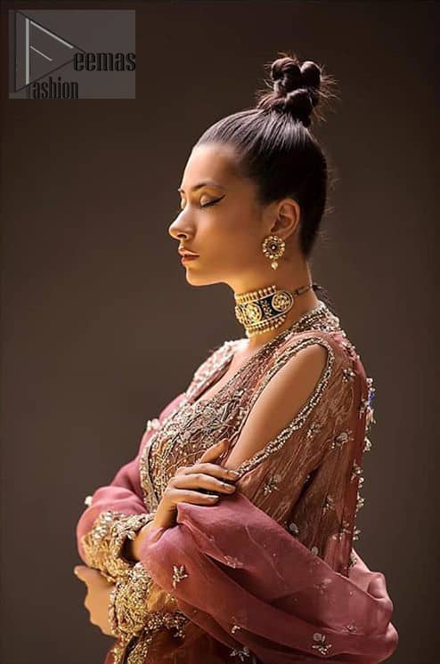 Take a step towards refreshing your wardrobe with this beautiful embroidered peplum. Beautiful embellishment created by artisans with hand done zardozi using resham, nakshi, dabki, hand cut sequins and dangling balls at the hemline. This meticulous wrap around peplum is also decorated with multiple color thread embroidery. Beautifully paired it up with copper rust tulip pants embellished with pearls. This outfit is comprises with organza dupatta with piping on all four sides and sequins spray all over.