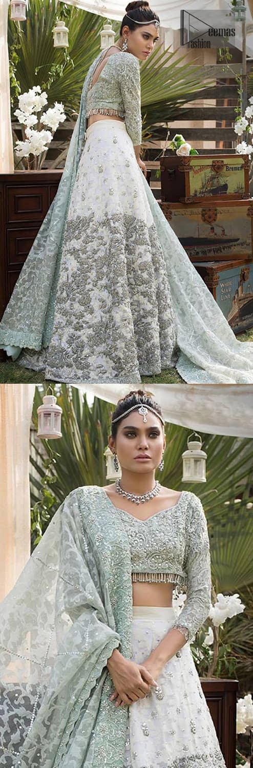 This bridal dress is perfect for your wedding or nikah day. Create a vision of elegance with this ivory self printed lehenga decorated with intricate zardosi detailing and silver kora, dabka and sequins. Furthermore it is adorned with scattered tiny floral motifs. Having quarter sleeves adorned with motifs. Beautifully coordinated with heavy embellished blouse with silver kora, dabka, sequins and pearls all over and finishing with tassels at the end. It comprises with light green self printed dupatta having matha patti border on the front and intricate beautiful border on all rest of the three sides.