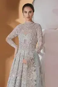 Take a step towards refreshing your wardrobe with this outfit. The frock is perfected with delicate golden and silver embroidery. Furthermore this shirt is made of rich floral embroidery which is enhanced with zardoze work. It is highlighted with kora, dabka, tilla, sequins and pearls. It comes with brocade churidar pajama. It is coordinated with tissue dupatta which is sprinkled with sequins all over it. It is further furnished with four sided matha patti style embellished border.
