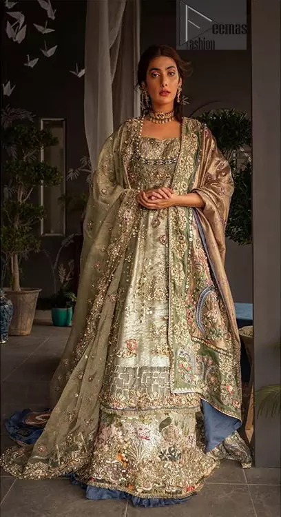This dress is perfect for your special day. This signature pishwas is crafted with organza featuring hand embroidery with elegant zardosi work. The bottom of the pishwas is enhanced with multiple color rich floral embroidery. The lehenga is timeless and elegant with a touch of modern trend,includes embroidery of kora, dabka, sequins and large floral motifs made up with multiple color resham threads. The dupatta incorporates beautifully designed borders on all four sides, focusing on the heavily embellished pallu borders to give it a perfect maharani look.
