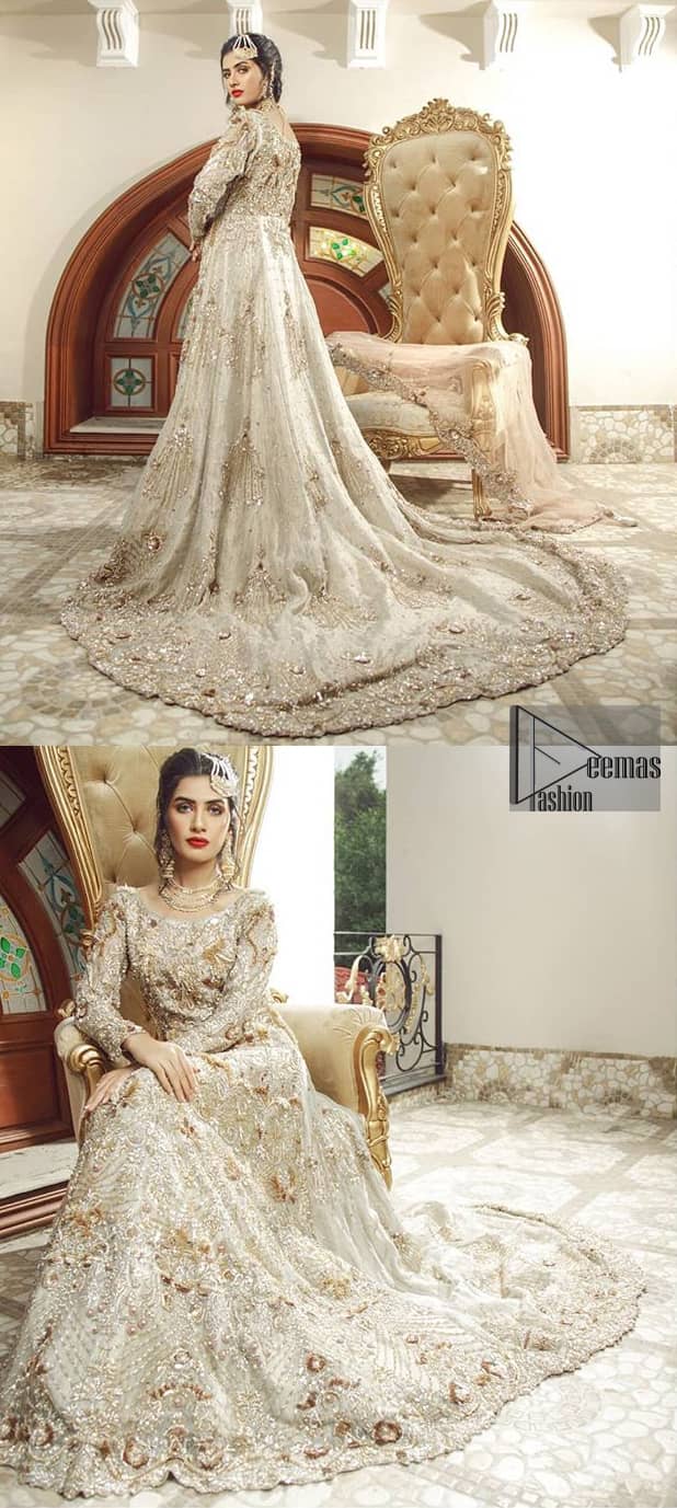 Bring out your beauty with this back trail maxi perfect for your big day. This bridal dress is beautifully sculptured with floral embroidery, adorned with cutwork borders embellished with silver kora, dabka, pearl and sequins work all over. The detailed resham and tilla work on the back of maxi and multiple floral motifs ornamented with gold kora and dabka embroidery on the bodice, the thick borders and floral bunches refined the classical royal look. Furthermore full length sleeves heavily embellished with zardosi work. It comprises with churidar pajama.