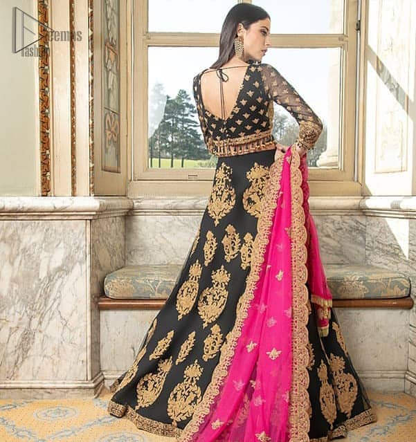 This outfit is an immensely captivating traditional piece, enhancing the art of classical heritage showcasing the craftsmanship of kora and dabka detailed with pearls; artistically embellished to give a beautiful rhythm to the outfit. Blouse is enhanced with zardosi work. It comes with full embellished lehenga adorned with different sizes motifs and finished with thin border. It is coordinated with pink chiffon dupatta which is sprinkled with small motifs all over. It is further furnished with four sided scalloped border.