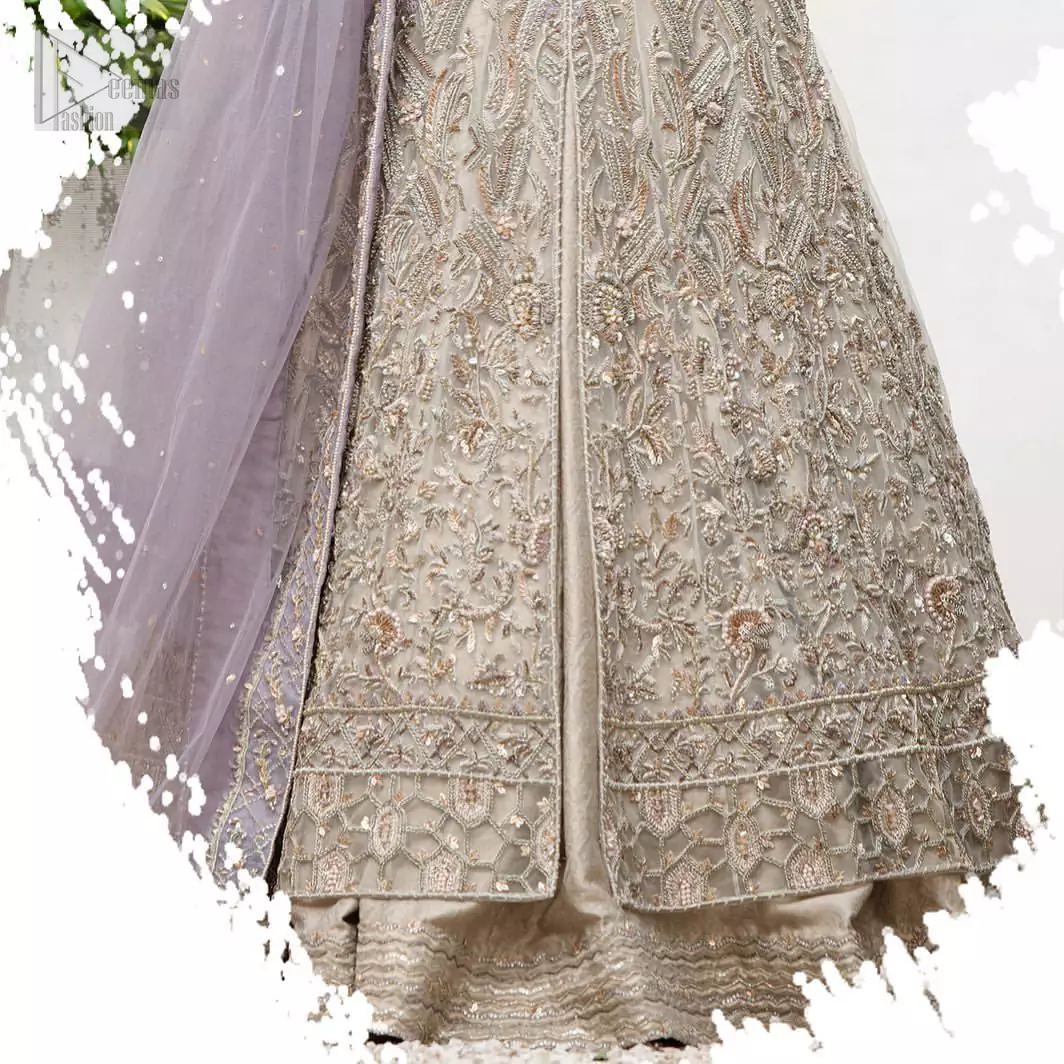 The ultimate in feminine elegance with fine detail to die for. Our bride makes a statement in this stunningly floraison, perfect blend of glamour and tradition with outstanding craftsmanship and gorgeous detailing. This front open pishwas is gorgeously decorated with floral bunches all over done with antique shaded zardozi work. It comprises with light beige jamawar lehenga with zardozi detail on the bottom. Style it up with light purple net dupatta sprinkled with sequins and four sided embellished border.The ultimate in feminine elegance with fine detail to die for. Our bride makes a statement in this stunningly floraison, perfect blend of glamour and tradition with outstanding craftsmanship and gorgeous detailing. This front open pishwas is gorgeously decorated with floral bunches all over done with antique shaded zardozi work. It comprises with light beige jamawar lehenga with zardozi detail on the bottom. Style it up with light purple net dupatta sprinkled with sequins and four sided embellished border.