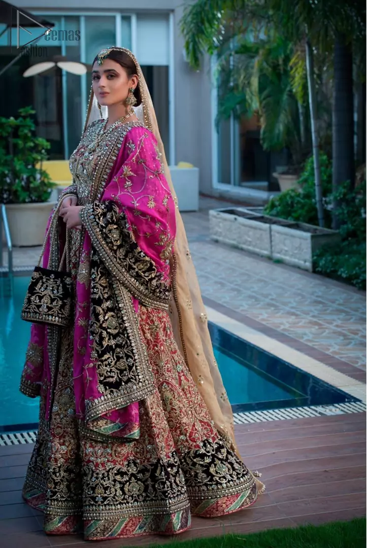 Complete your big day with the perfect dress in our selection of stunning wedding dresses. This regal lehenga blouse is an immensely captivating traditional piece, enhancing the art of classical heritage showcasing the craftsmanship of kora, dabka, tilla and sequibs detailed with pearls, artistically embellished to give a beautiful rhythm to the outfit. The lehenga is adorned with golden and antique shaded embroidery. Furthermore the bottom of the lehenga is enhanced with black embellished applique. Coordinated with beige dupatta sprinkled with sequins all over.