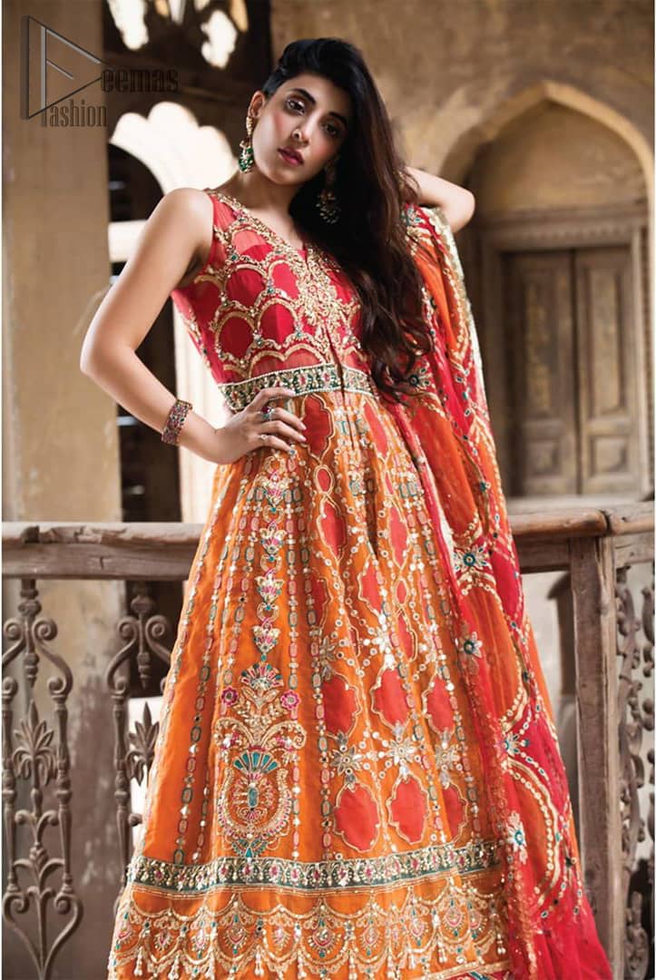This artisanal piece is rendered in grace and timelessness. Brighten up your look with this mix of floral and geometrical embroidery in vibrant tones spread across on red and orange canvas. The front open pishwas is delicately crafted with zardozi work, multiple color embroidery and mirror work. Furthermore it is also adorned with green embellished applique and the colorful applique lift the whole bottom. It comprises with orange sharara. Finished the dress with red and orange organza dupatta with geometric patterns on the ground.