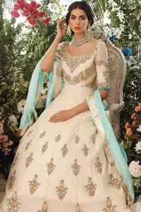 This outfit should be the next addition to your wardrobe. An example of beauty and elegance. Look breathtakingly stylish in this embroidered regalia furnished with intricate embroidered neckline which is embellished with antique shaded zardozi work and ferozi stones. Furthermore, this multiple panel frock is adorned with different sized motifs scattered all over the frock. It is coordinated with ivory churidar pajama. Finished the look with self printed chiffon dupatta having four sided applique on it.