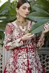 This front open marron maxi is creating a dreamy composition. The chic yet elegant front open maxi is decorated with floral embroidery , heavily embellished bodice and floral bunches. Hemline is even more enhanced with birds motifs finished with jamawar lining adorned with geometric patterns in it. The embroidery is done with silver and white kora, dabka, tilla, and pearls. It comes with straight trousers allured with sprinkled motifs on dupatta dupatta finished with silver lace all around the edges.  