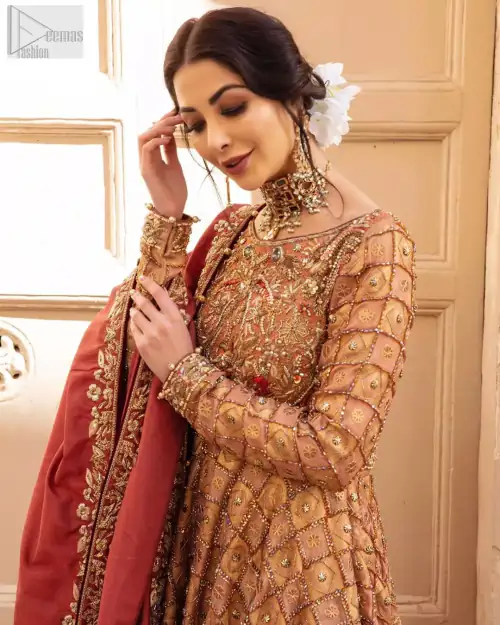 Chic and sophisticated perfectly describe this simply stunning wedding dress. This artisan piece includes intricate hand embellishment. This technique gives