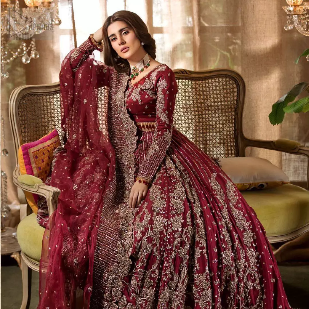 Make your big day more beautiful with our excessively embroidered lehenga blouse featuring delicately embellished back train along with scalloped finishing highlighted with antique embroidered detailing and intricately frilled inner that gives perfect ending to this outfit. The blouse is delicately crafted with antique zardosi work having full sleeves with dangling finishing. It is paired with an ethereal bridal dupatta focusing on kora and dabka handwork borders on all four sides, finished with scalloped borders. With a flowing trail, this is an ensemble that deserves to be flaunted.