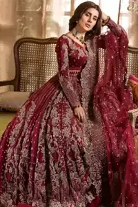 Make your big day more beautiful with our excessively embroidered lehenga blouse featuring delicately embellished back train along with scalloped finishing highlighted with antique embroidered detailing and intricately frilled inner that gives perfect ending to this outfit. The blouse is delicately crafted with antique zardosi work having full sleeves with dangling finishing. It is paired with an ethereal bridal dupatta focusing on kora and dabka handwork borders on all four sides, finished with scalloped borders. With a flowing trail, this is an ensemble that deserves to be flaunted.