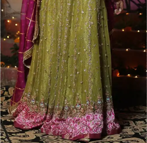 Nothing speaks of femininity and class louder than this mehndi outfits for bridesmaids. The sequinned whimsical florals embroidered across the