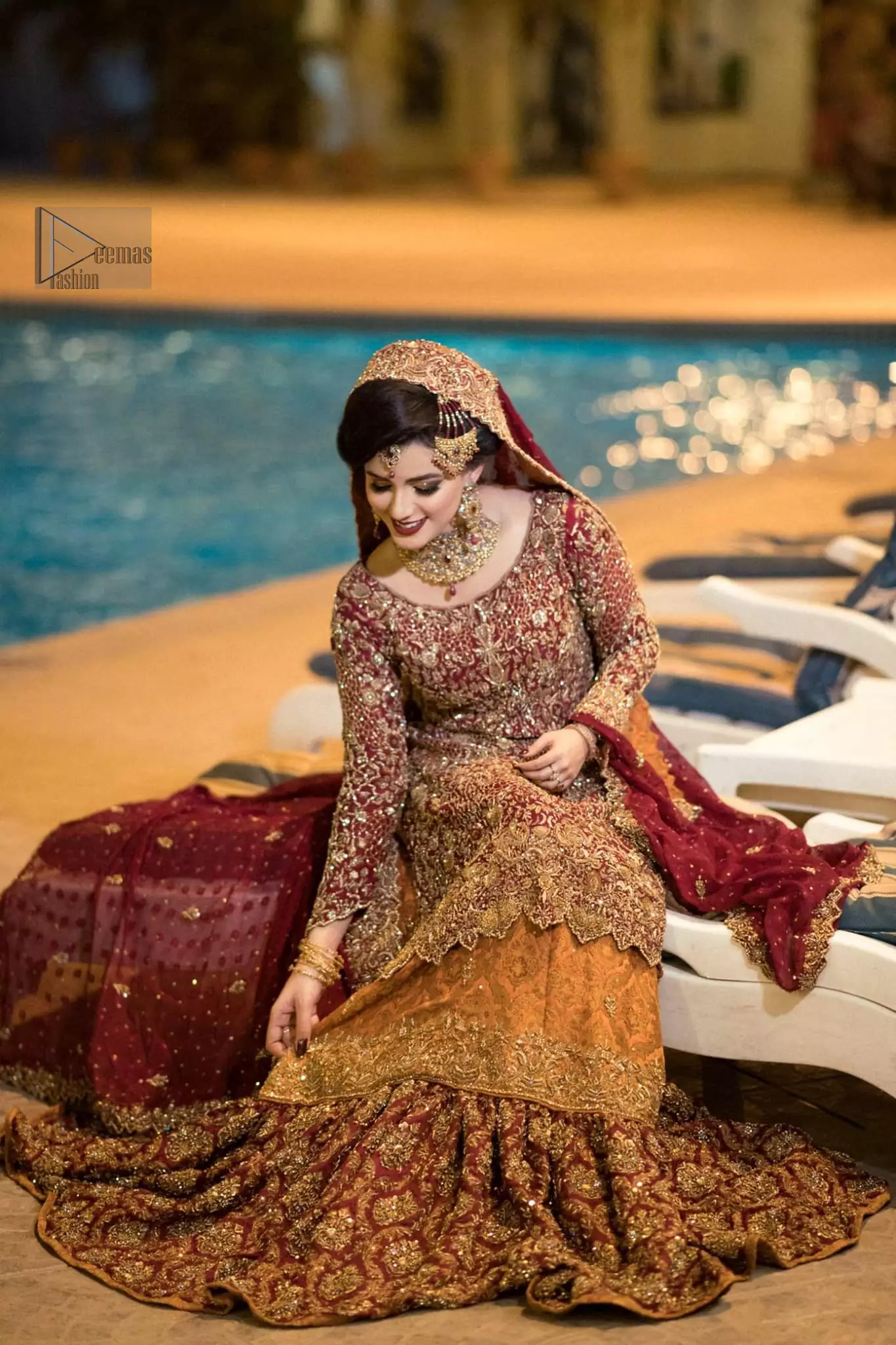Pakistani Reception Wear - Maroon Shirt – Rust and Maroon Lehenga. You are all set to make a lasting impact with the divine royalty of this dress. This ravishing ensemble is sure to make you look like glamorous royalty with immaculate work covering every inch of the shirt. It boasts a pretty scallop hemline and full sleeves with zardozi embellishment. Compliment the look with flared lehenga. The combination of rust with maroon is absolutely breathtaking. Elegance is personified when it gets paired up with an all-over sequins spray-on dupatta with alternating scalloped borders detailing. This is an ensemble that deserves to be flaunted.