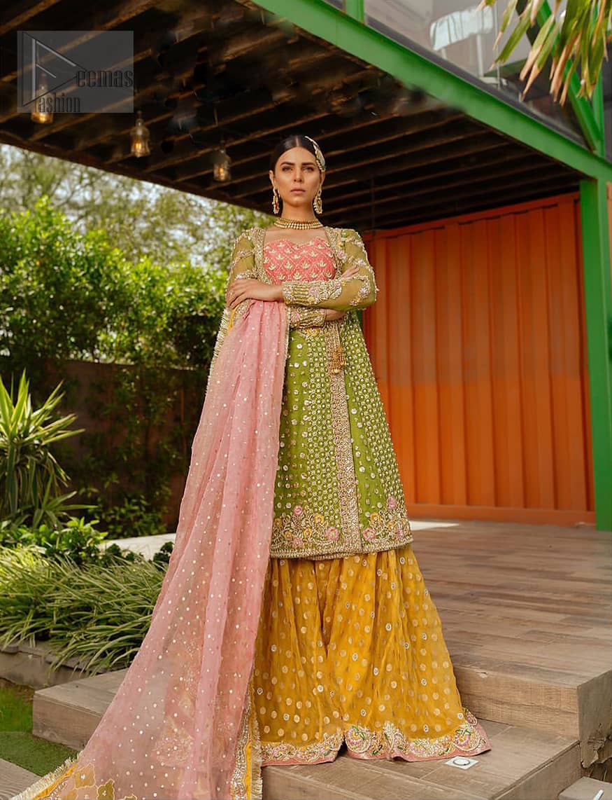 We have brought a charismatic charm to the traditional motifs and cuts. Our embroidery is rich in detailed traditional techniques executed to perfection. The bride shines bright in this outfit, embedded with sophisticated zardozi and thread embeishments. The bodice and hemline is furthermore emphasized with intricate details that gives the perfect ending to this mehndi dress. Pair it up with yellow sharara with captivating embellished border. The dupatta incorporates beautifully designed borders with zardozi, applique and kiran along the length, focusing on the geometrically embellished pallu and sequins spray all over to give it a perfect look.