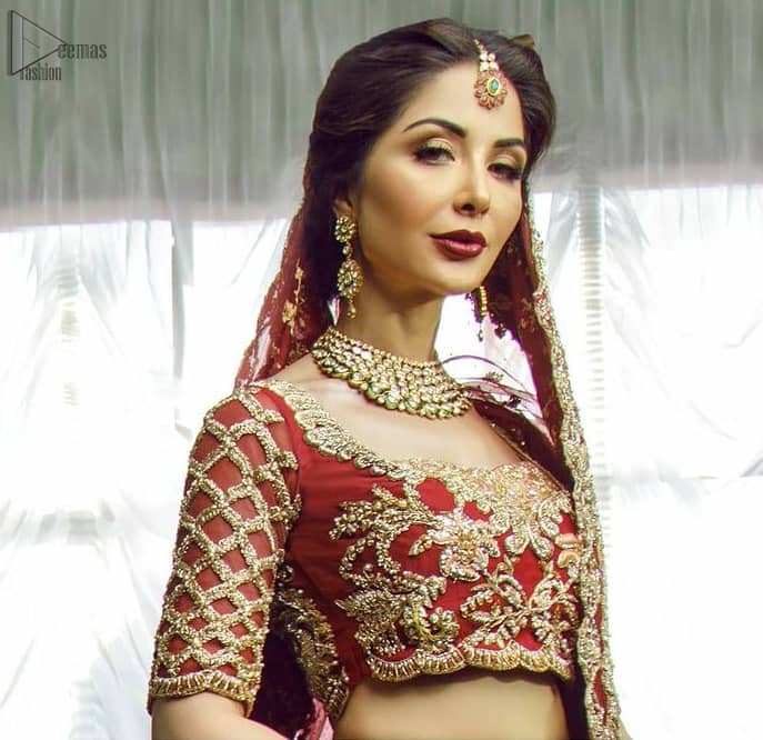 Steal the moment with our red blouse emphasized with a sweetheart neckline and intricate loaded floral embroidery on Lehenga enhanced with gold kora, dabka and sequins. Modern yet traditional.
